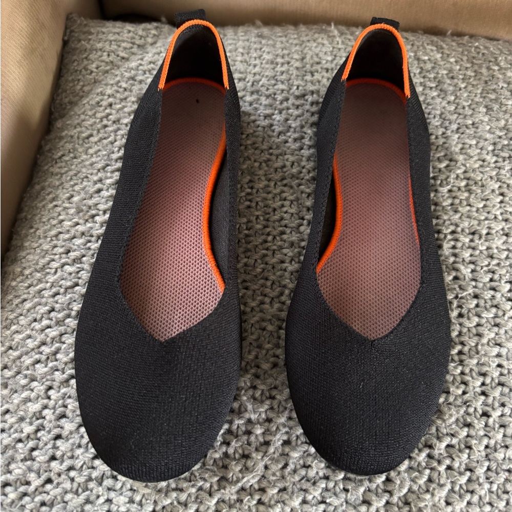 Black and Orange Slip-On Flats with Minimalist Design